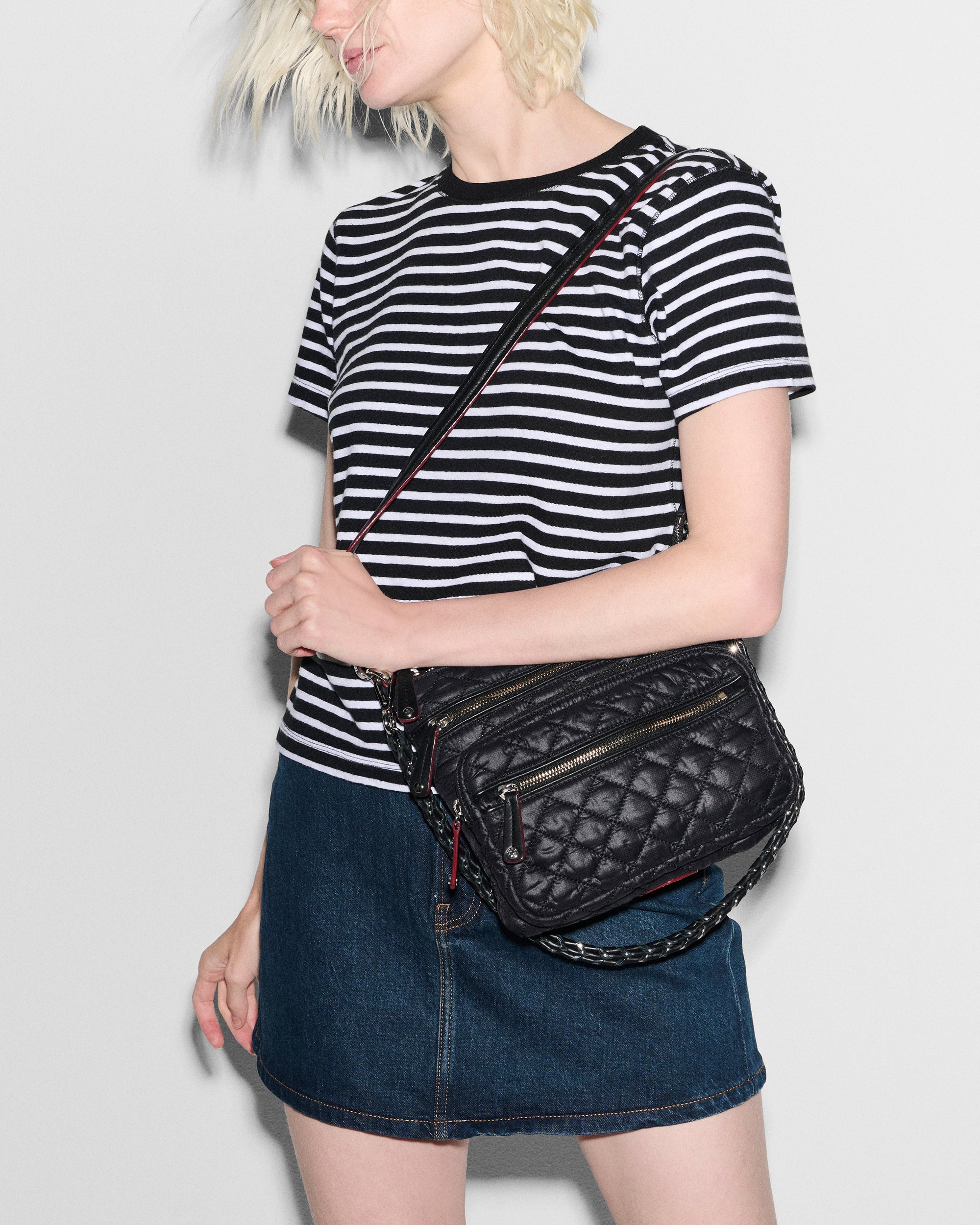 MZ Wallace Double Zip Crossbody Bag hanging off woman's shoulder