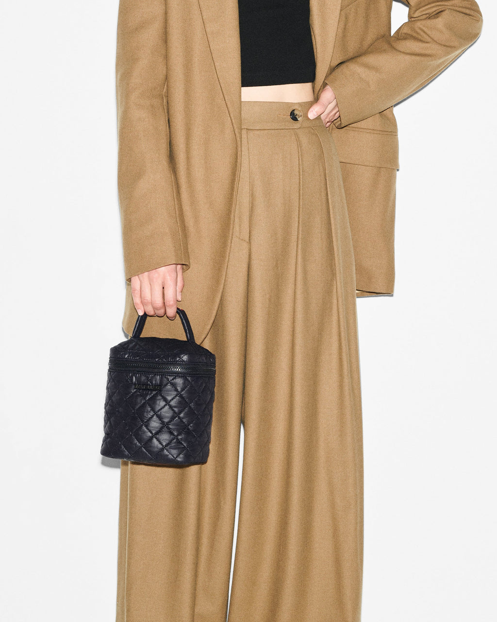 Person holding MZ Wallace Large Black Vanity Bag
