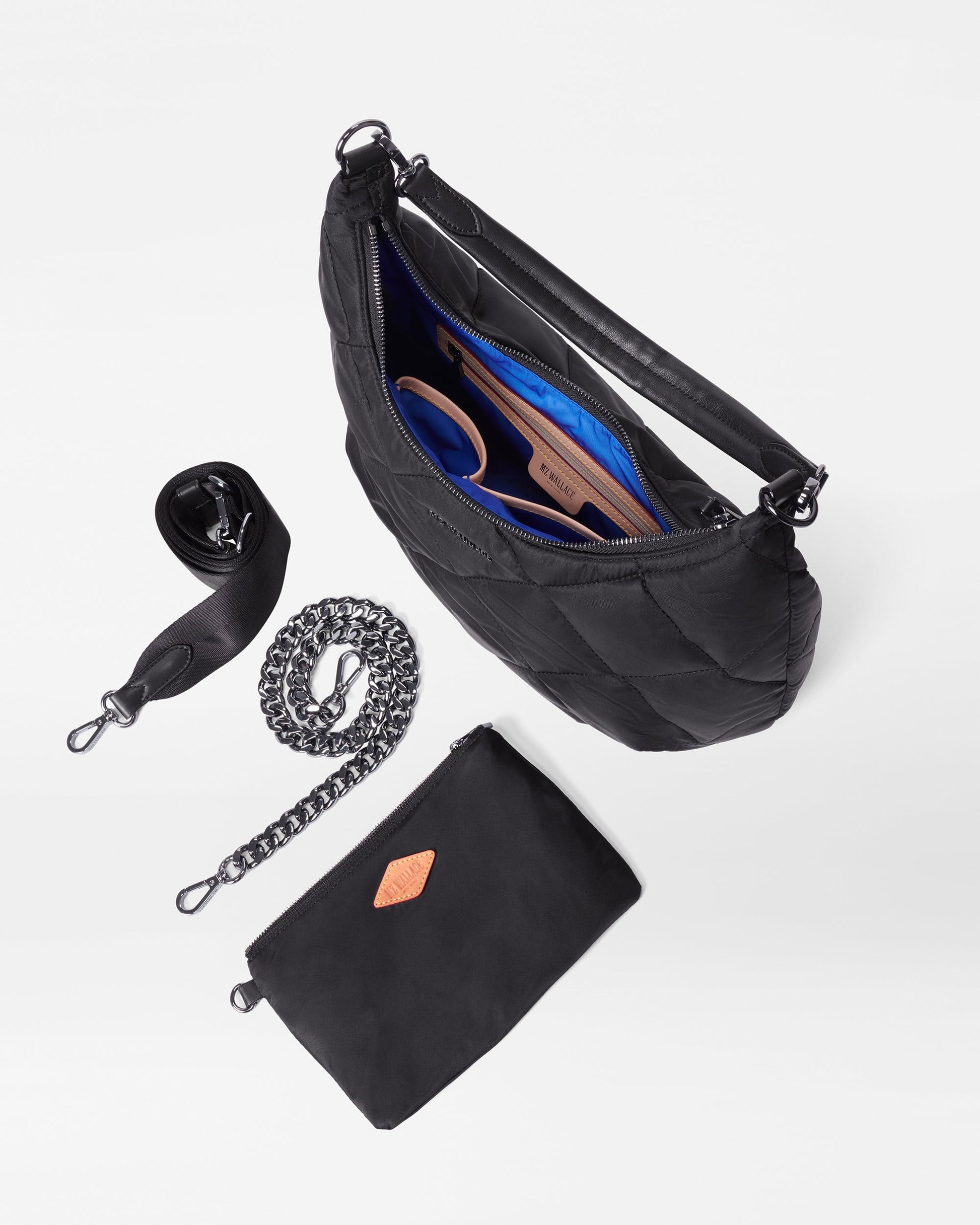 MZ Wallace Black Quilted Shoulder Bag opened with accessories