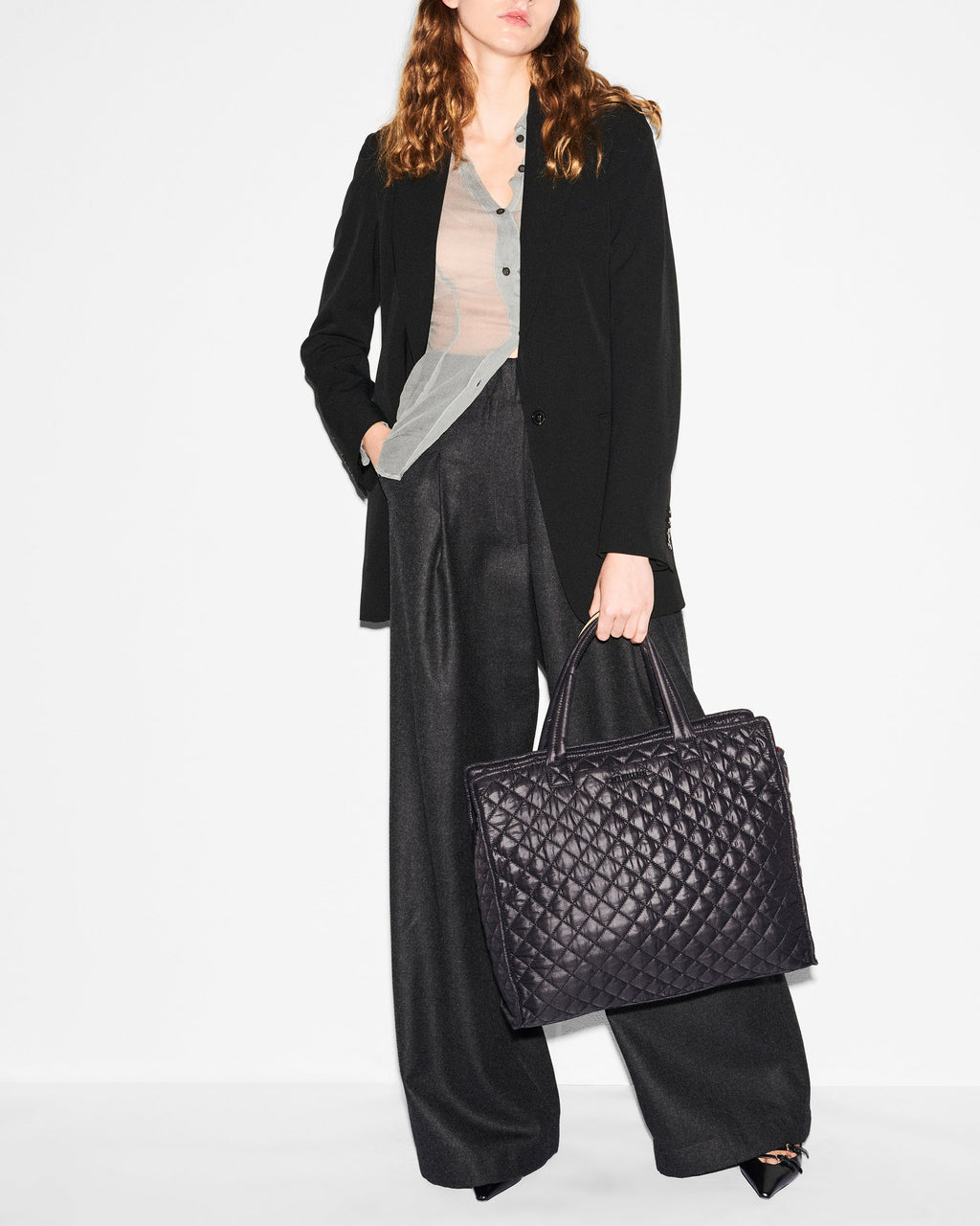 Woman holding MZ Wallace Large Black Structured Tote Bag
