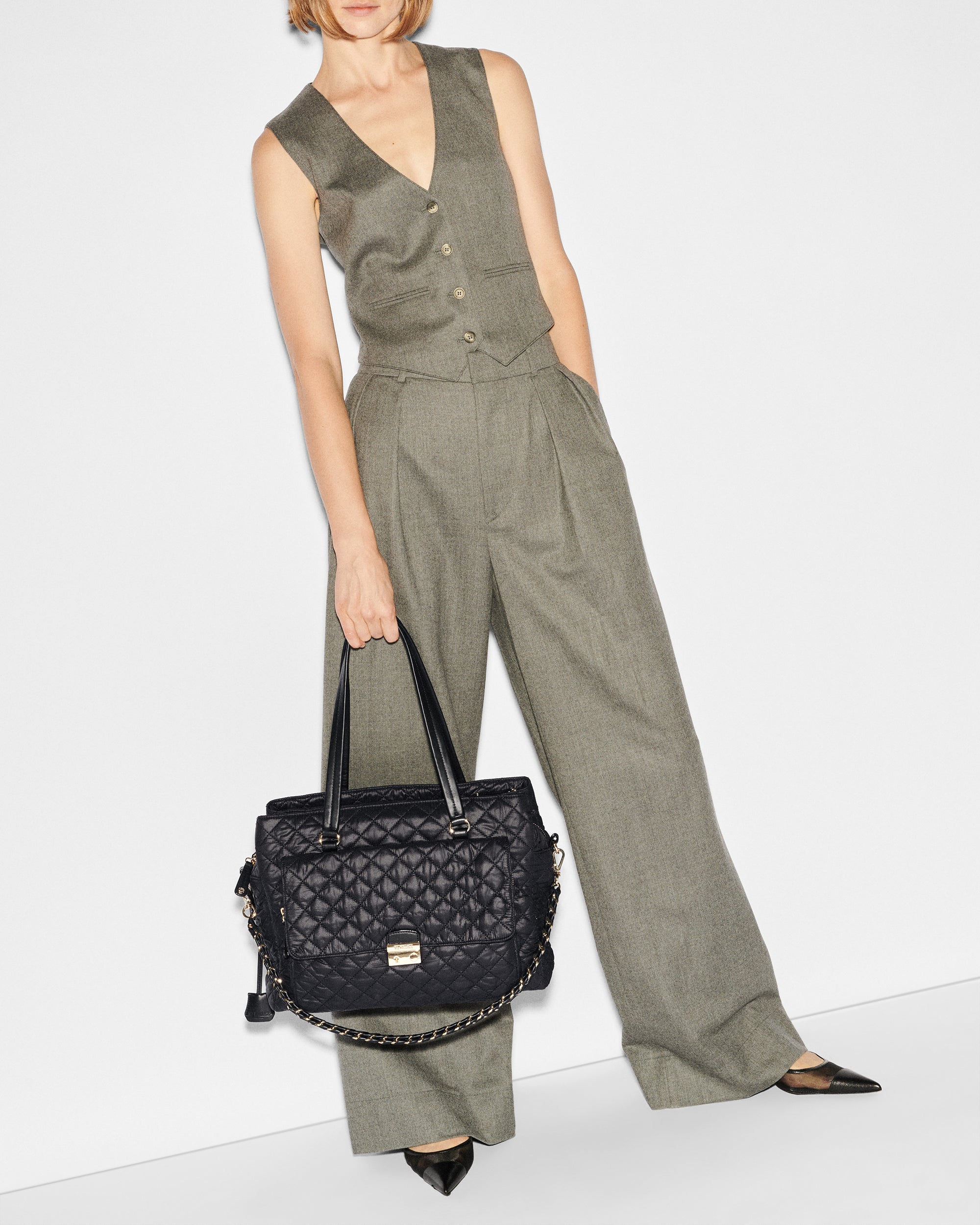 Woman holding MZ Wallace Black Structured Work Bag in her hands