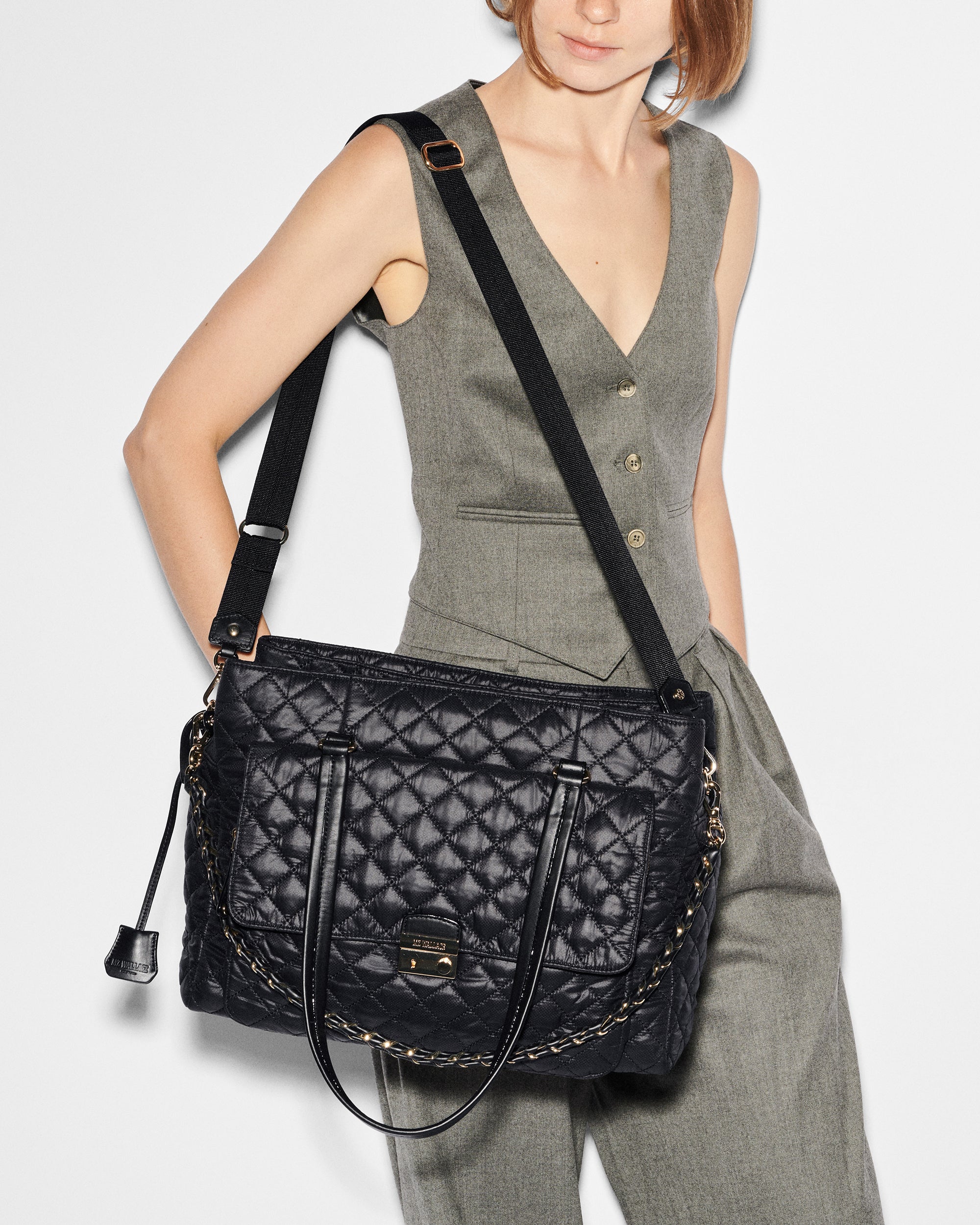 Attachable strap on woman's shoulder for the MZ Wallace Black Structured Work Bag