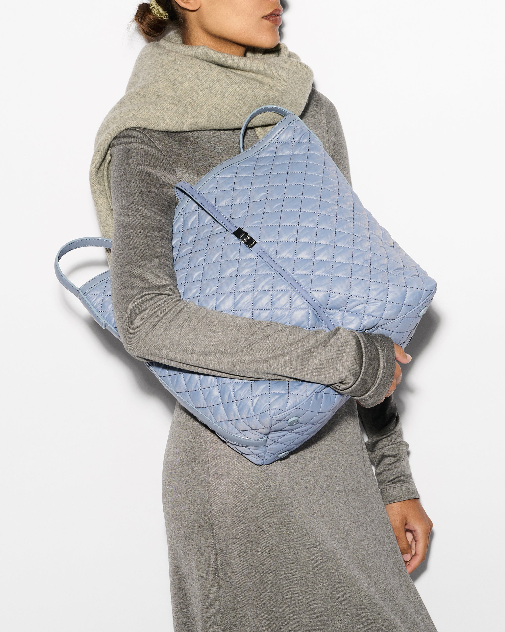 Woman holding MZ Wallace Baby Blue Shoulder Bag