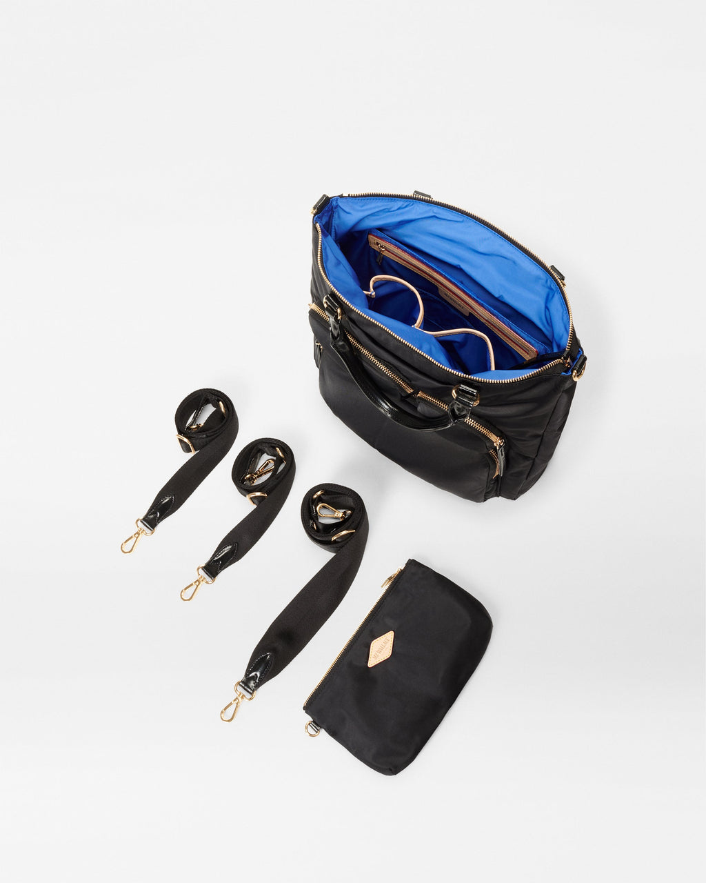 MZ Wallace Stylish Black Backpack open with different straps and accessories