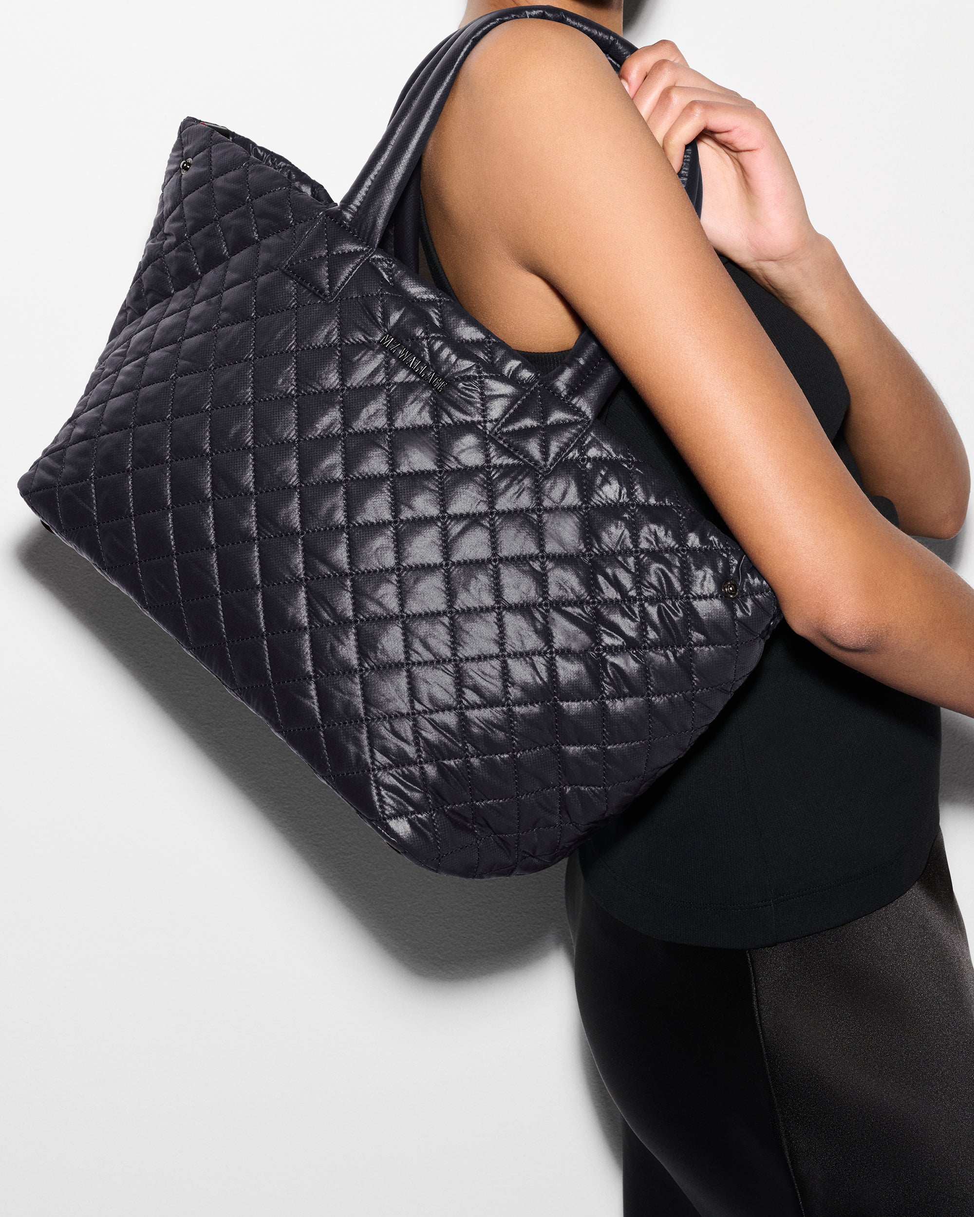 MZ Wallace Black Work Shoulder Bag on woman's shoulder