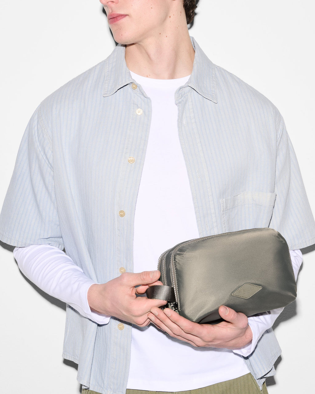 Model with Sage Green Dopp Kit Bag 