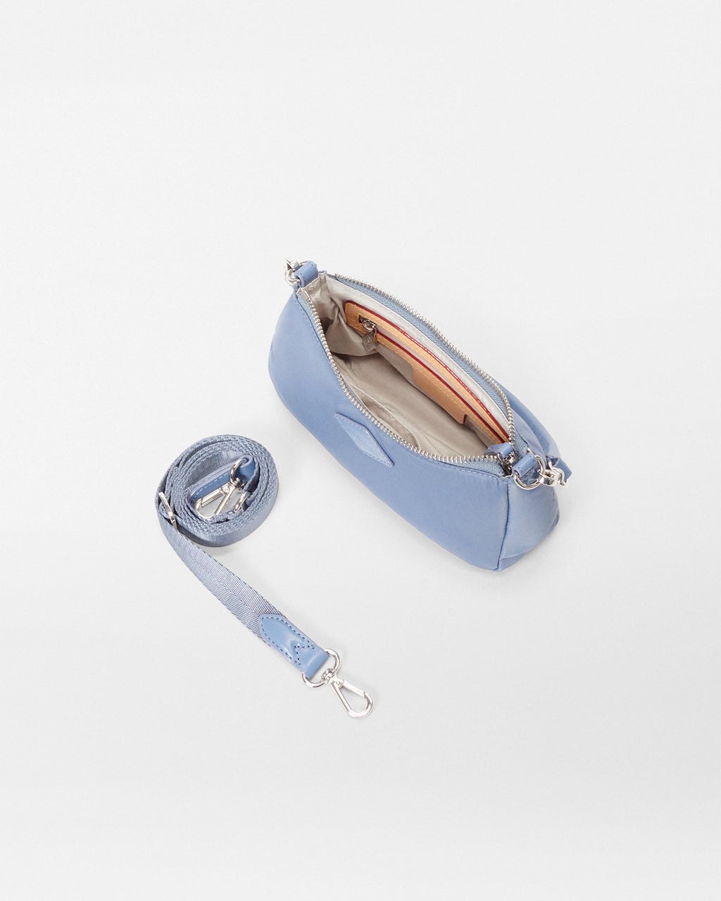 Inside view of MZ Wallace Mini Blue Purse with crossbody strap